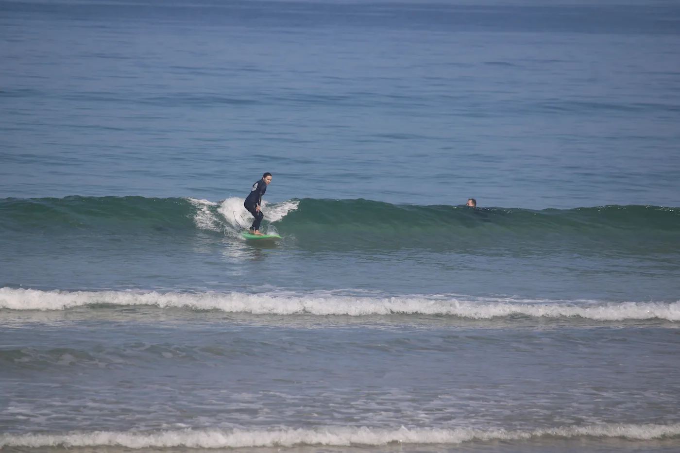 A surfer settling into a clean wave