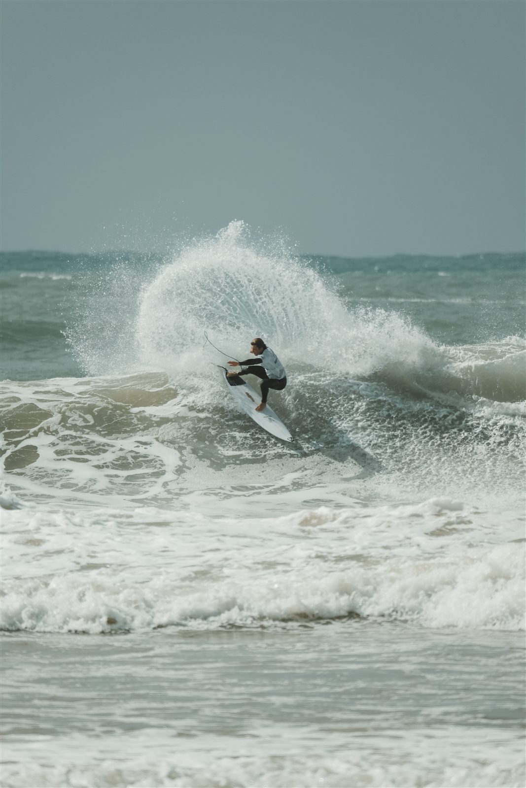 Surfers in the lineup on Portugal's West Coast