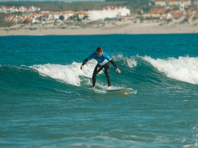 A surfer riding a clean wave off Peniche